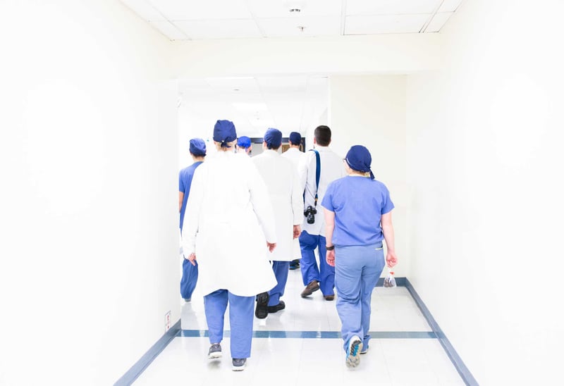Healthcare Team Walking Down Aisle